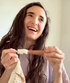Laughing crocheter holding the counting hook